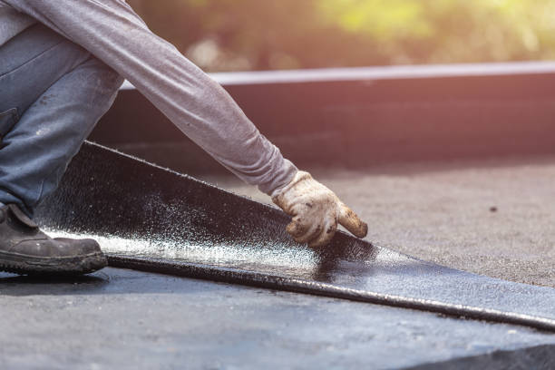 Professional Waterproofing technician working in East Setauket, NY